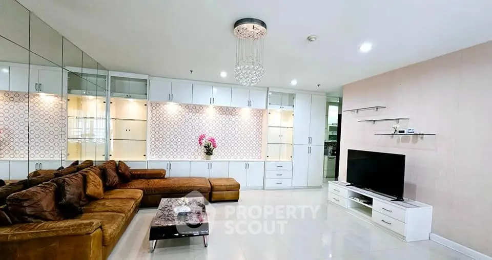 Luxurious living room with modern decor and elegant chandelier