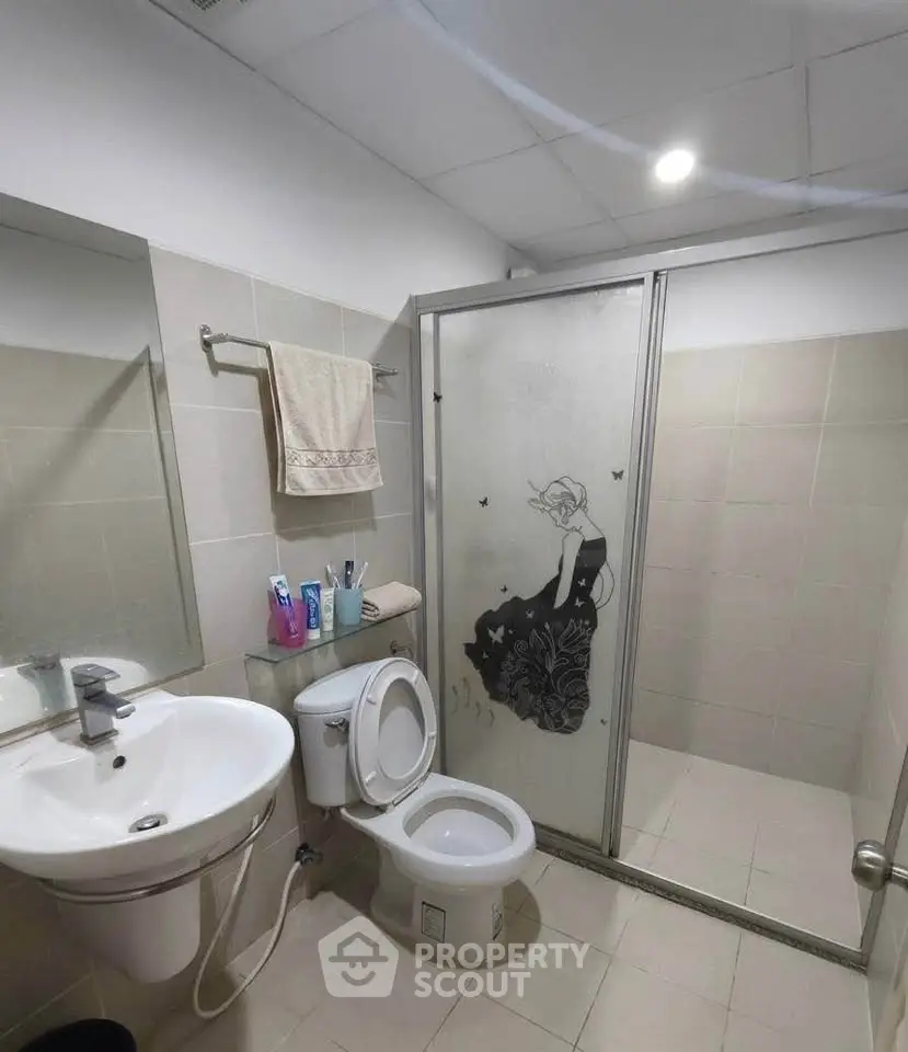 Modern bathroom with stylish shower design and elegant fixtures.