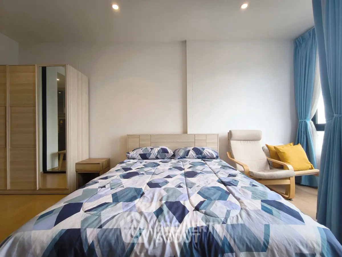 Modern bedroom with stylish decor and natural light