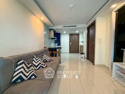 Modern living room with stylish decor and open kitchen layout