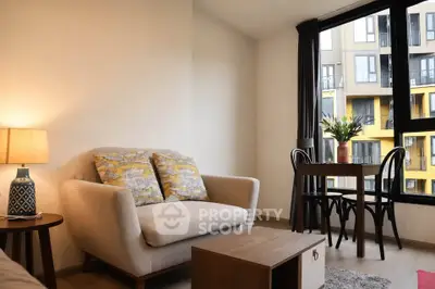 Cozy living room with modern decor and large window view