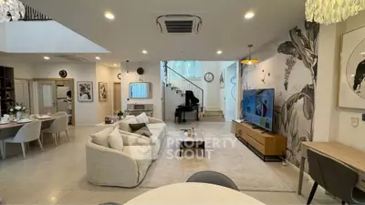 Luxurious open-plan living room with elegant decor and modern furniture