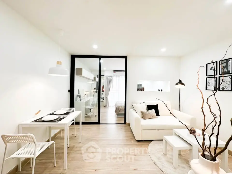 Modern open-plan living room with stylish decor and natural light