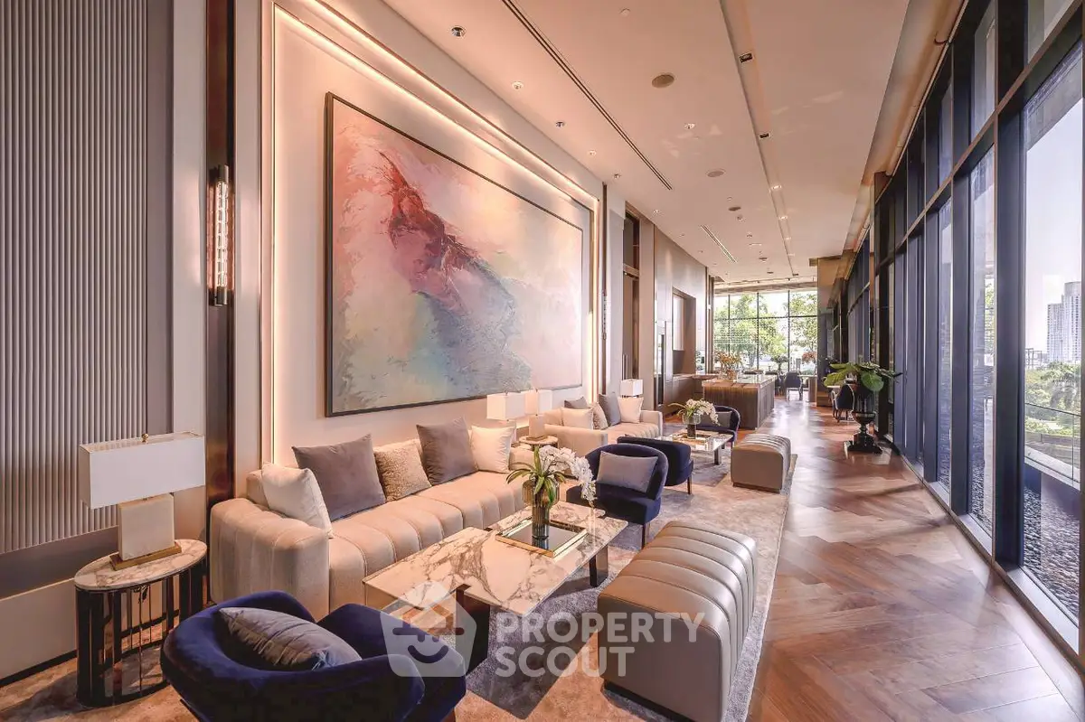 Luxurious modern living room with elegant decor and large windows offering stunning city views.