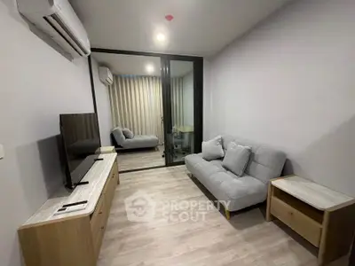Modern living room with sleek furniture and air conditioning in a cozy apartment.