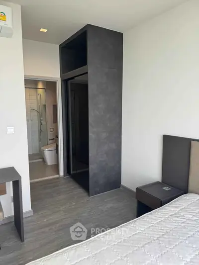 Modern bedroom with ensuite bathroom and sleek design