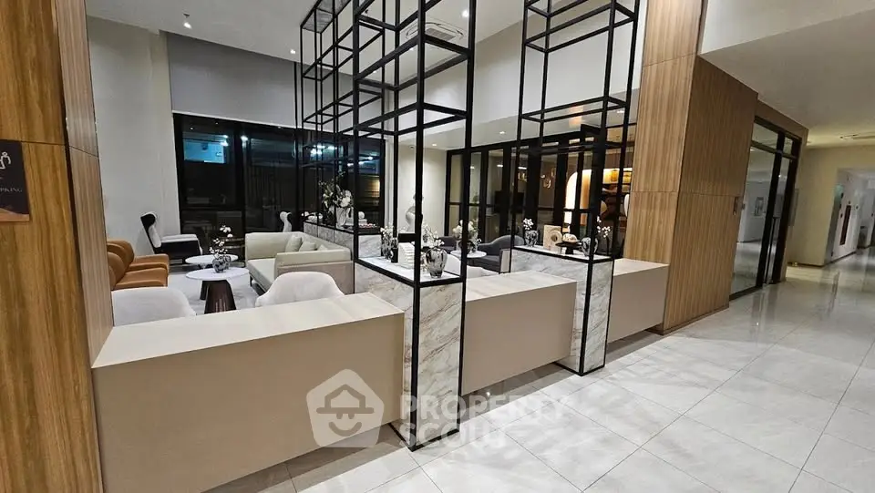 Elegant modern lobby with stylish seating and decorative elements in a contemporary building.