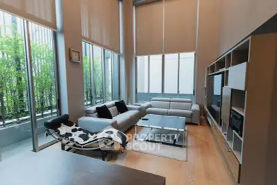 Spacious modern living room with high ceilings and stylish furniture