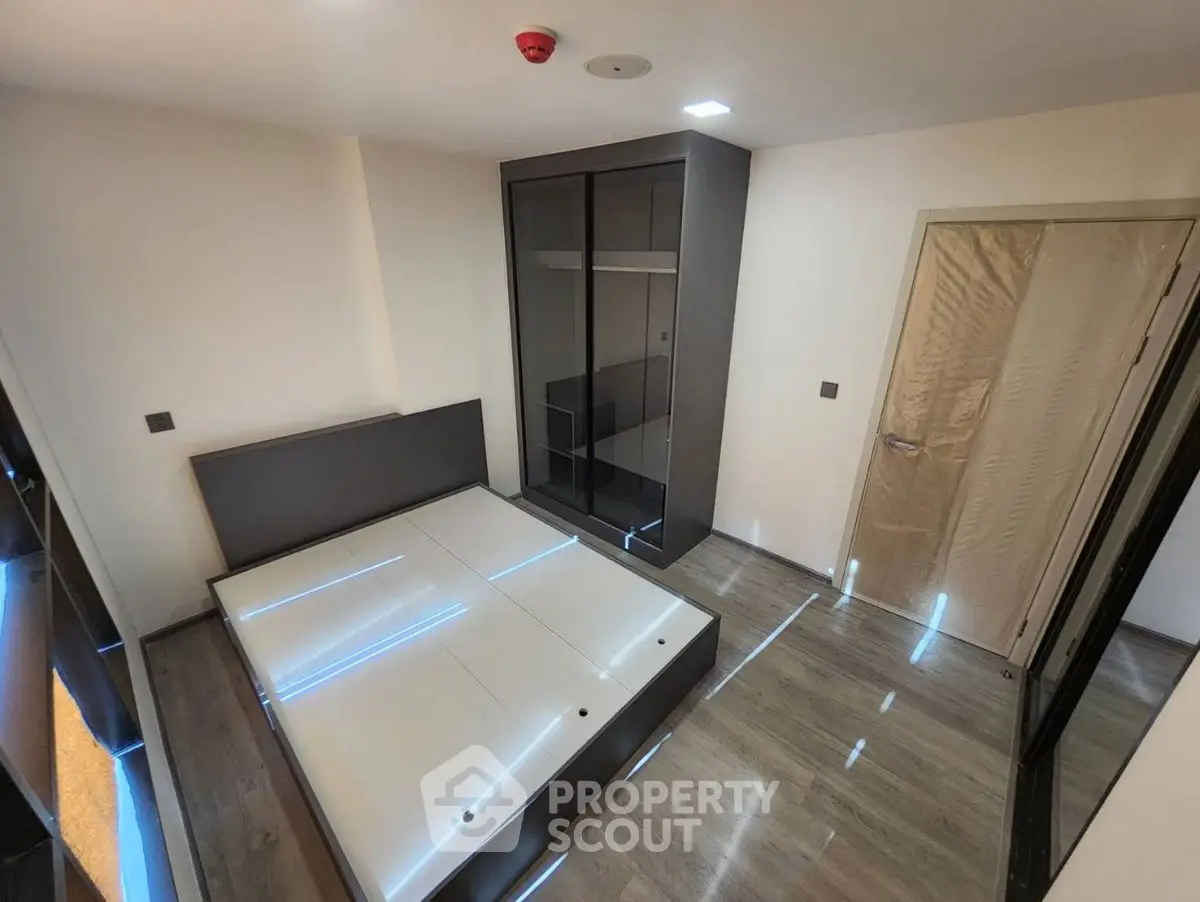 Modern bedroom with sleek design and ample storage space