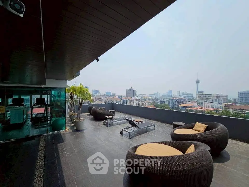 Stunning rooftop terrace with panoramic city views and modern outdoor seating.