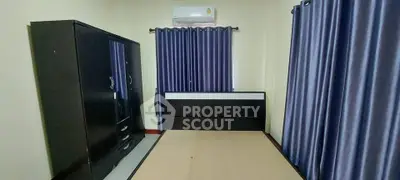 Spacious bedroom with modern furniture and air conditioning