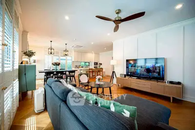 Spacious modern living room with stylish decor and open kitchen layout