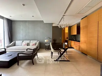 Modern open-plan living room with sleek kitchen and elegant dining area