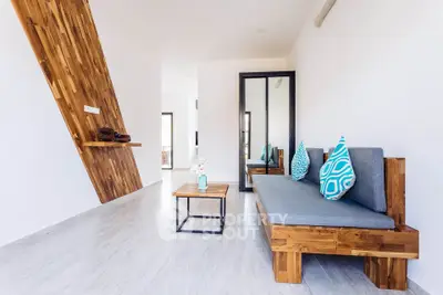 Modern living room with stylish wooden furniture and minimalist decor