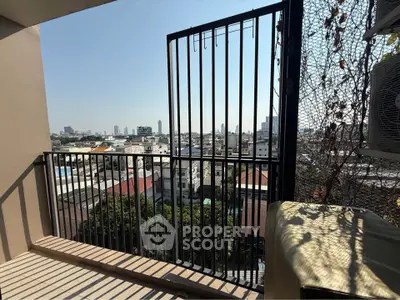 Charming balcony with cityscape view, perfect for relaxation and enjoying urban scenery.