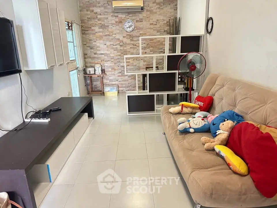 Cozy living room with modern decor and comfortable seating, perfect for relaxation and entertainment.
