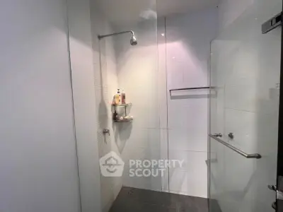 Modern bathroom with glass shower enclosure and sleek design