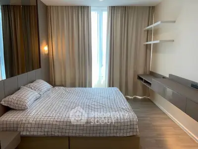 Modern bedroom with stylish decor and ample natural light