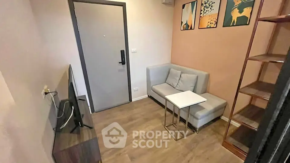 Cozy living room with modern decor and compact furniture, perfect for urban living.