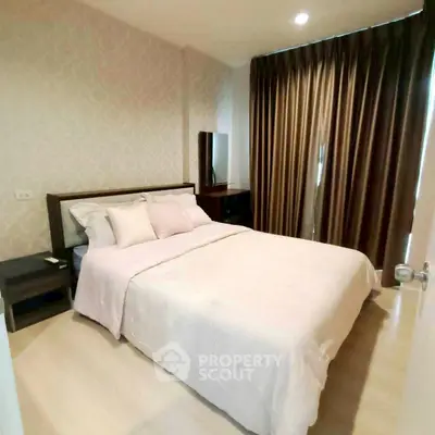 Cozy bedroom with elegant decor and soft lighting, featuring a comfortable bed and stylish curtains.