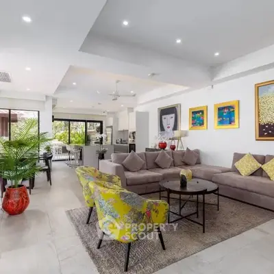 Spacious modern living room with stylish decor and open layout, perfect for entertaining.