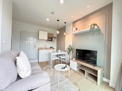 Modern living room with cozy seating and stylish decor in a bright apartment