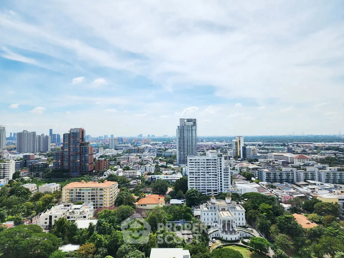 Stunning cityscape view showcasing urban skyline and lush greenery, perfect for real estate investment.