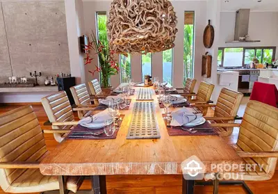 Luxurious dining room with elegant table setting and unique chandelier in modern home