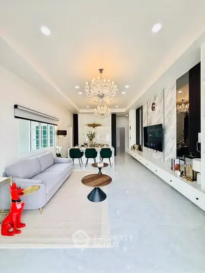 Luxurious modern living room with elegant chandelier and stylish decor