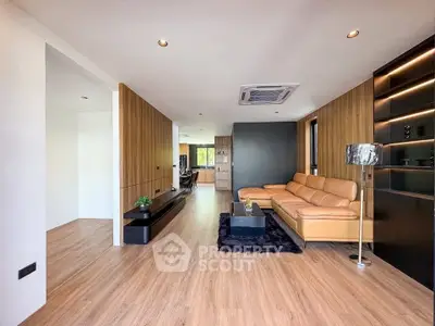 Spacious modern living room with stylish decor and wooden accents