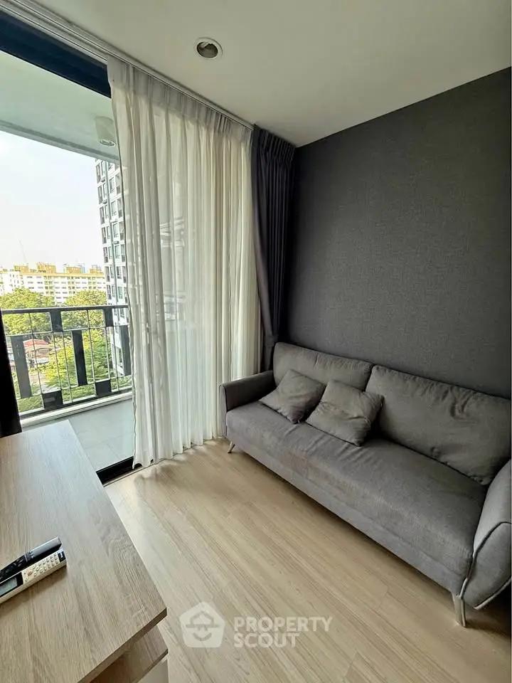 Modern living room with balcony view in urban apartment