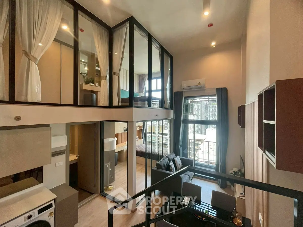 Modern duplex apartment with stylish interior and large windows