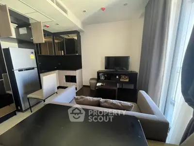 Modern living room with sleek furniture and natural light, perfect for urban living.