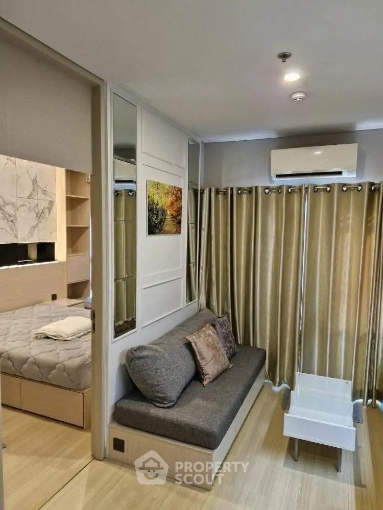 Modern living room with cozy sofa and elegant decor in a compact apartment