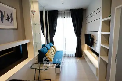 Modern living room with sleek design and natural light, featuring a cozy sofa and wall-mounted TV.