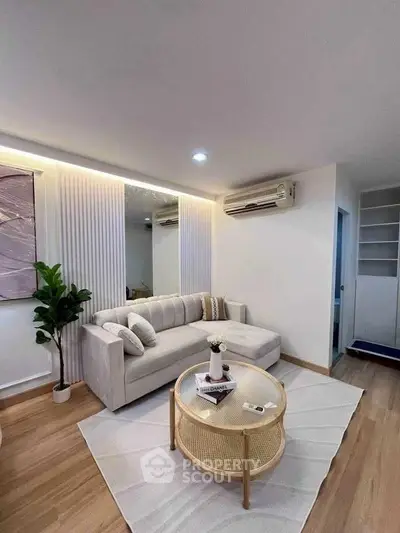 Modern living room with stylish decor, cozy sofa, and elegant lighting in a contemporary apartment.