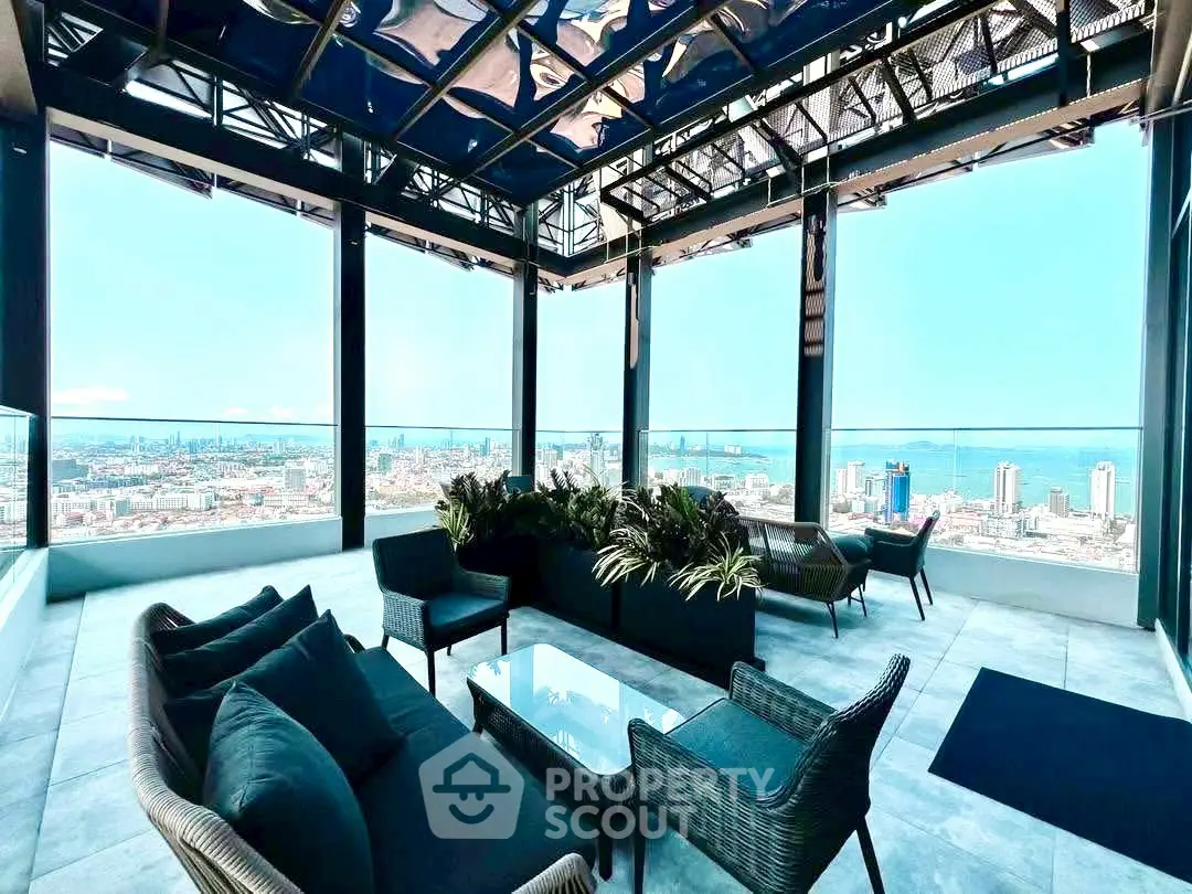 Stunning rooftop terrace with panoramic city views and modern outdoor seating.
