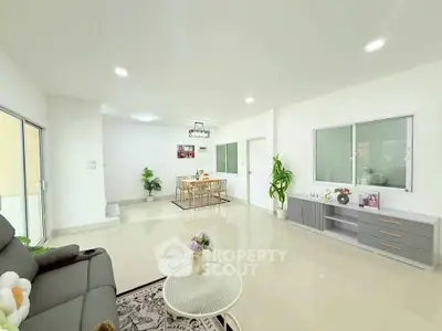 Spacious modern living room with elegant dining area and stylish decor