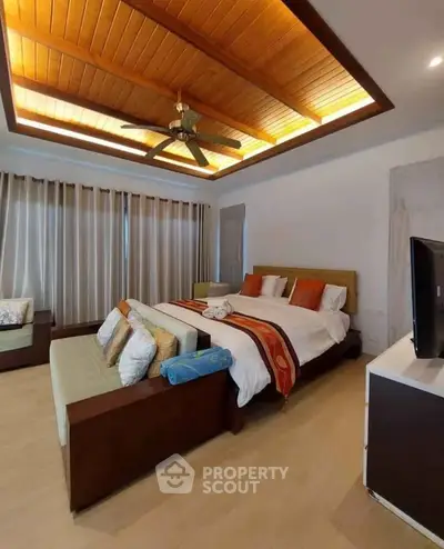 Luxurious bedroom with elegant wooden ceiling and modern decor