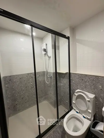 Modern bathroom with glass shower enclosure and sleek design