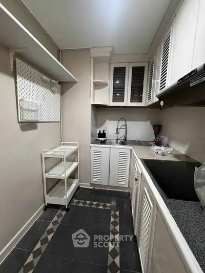 Charming kitchen with modern cabinetry and sleek countertops, perfect for culinary enthusiasts.