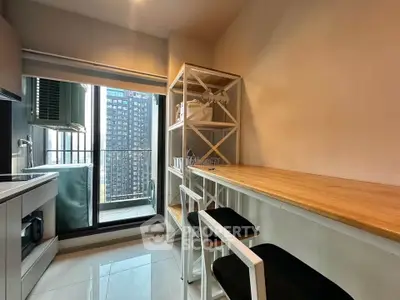 Modern kitchen with sleek design and balcony view in urban apartment