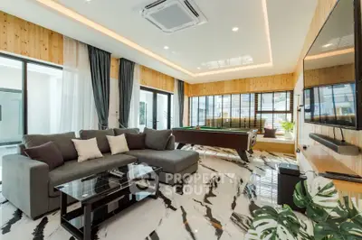 Luxurious modern living room with pool table and stylish decor