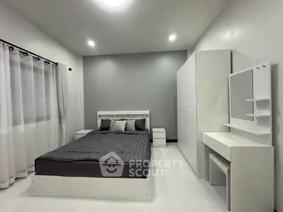 Modern minimalist bedroom with sleek furniture and neutral tones