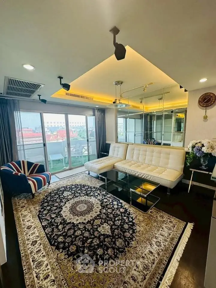 Luxurious living room with elegant decor and large windows offering city views.
