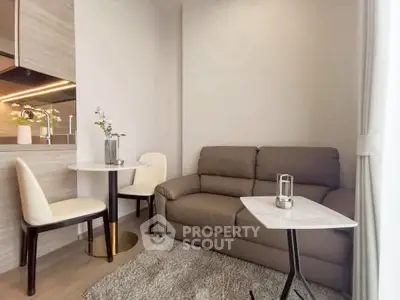 Cozy living room with modern furniture and open kitchen layout