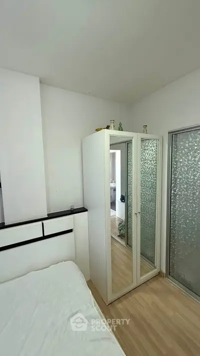 Modern bedroom with sleek wardrobe and minimalist design