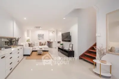 Spacious modern living room with elegant decor and open layout, perfect for comfortable living.
