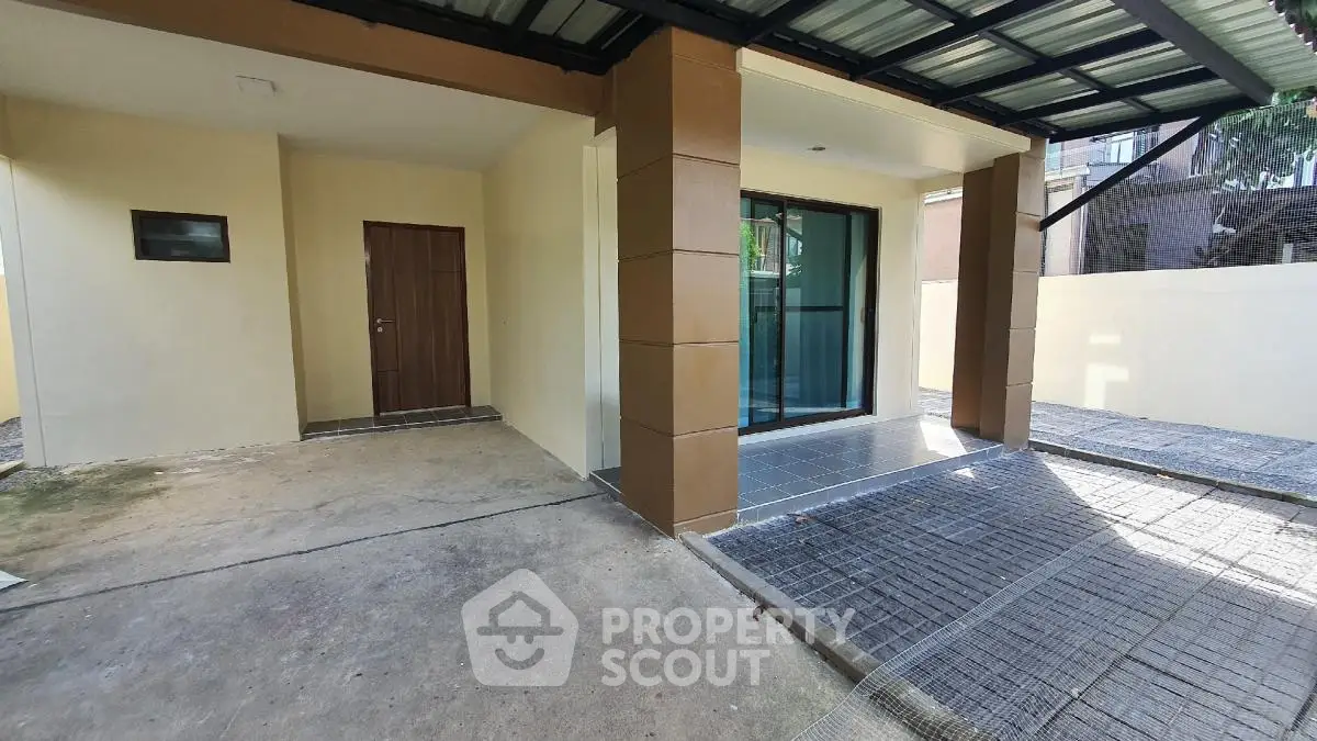 Modern covered parking area with sleek design and secure entrance