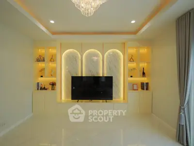 Luxurious living room with elegant built-in shelving and modern TV setup